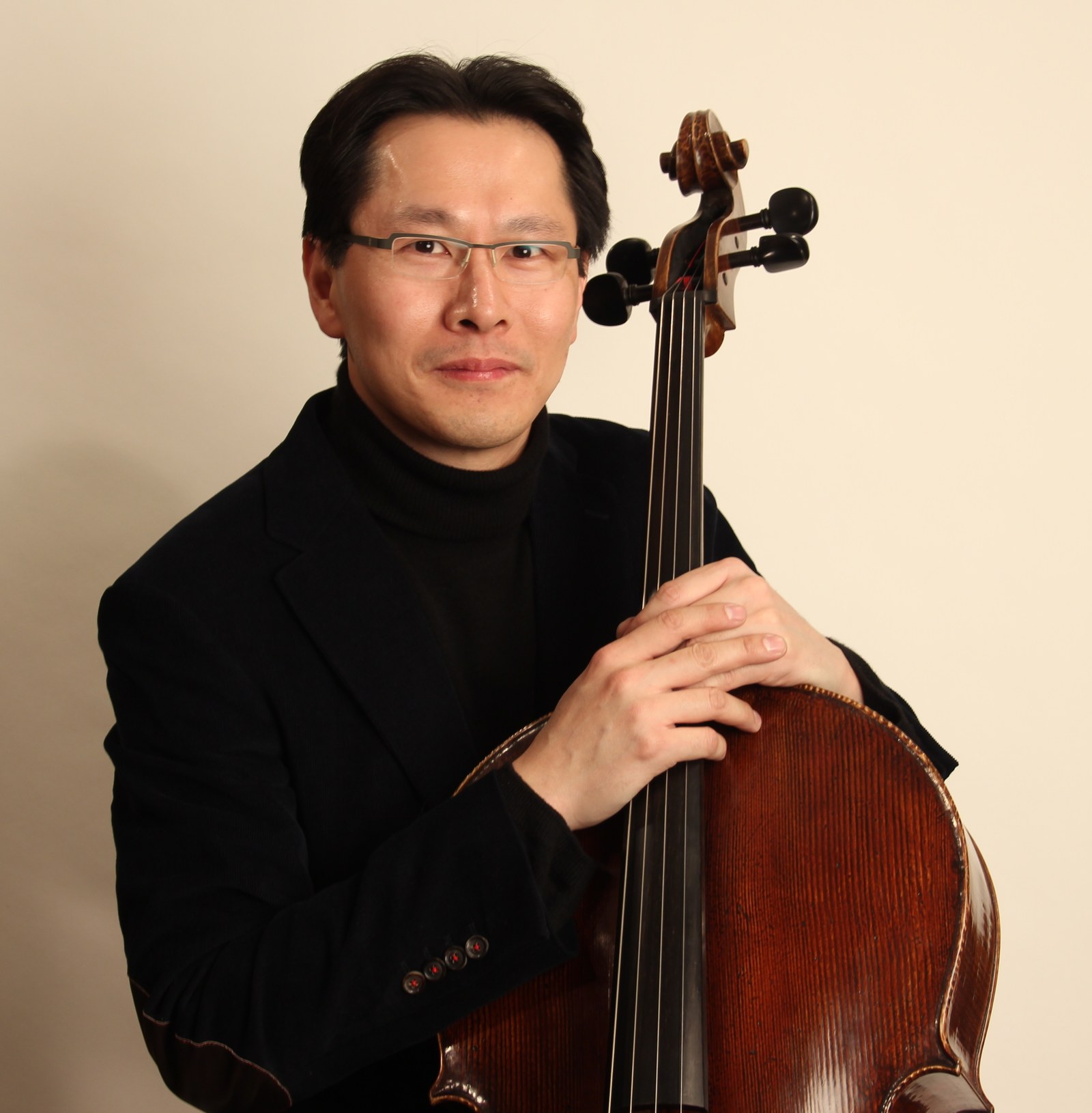 Kenneth Kuo, founder of Rental Instrument, with his cello
