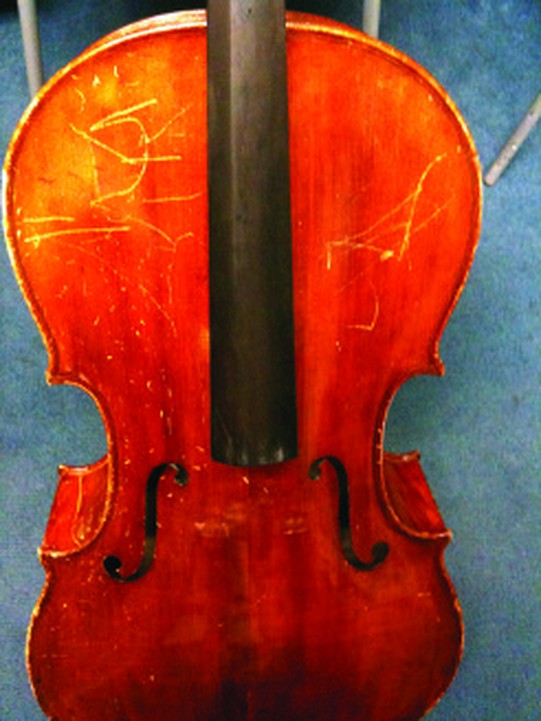 Cracked cello top before repair at our bench