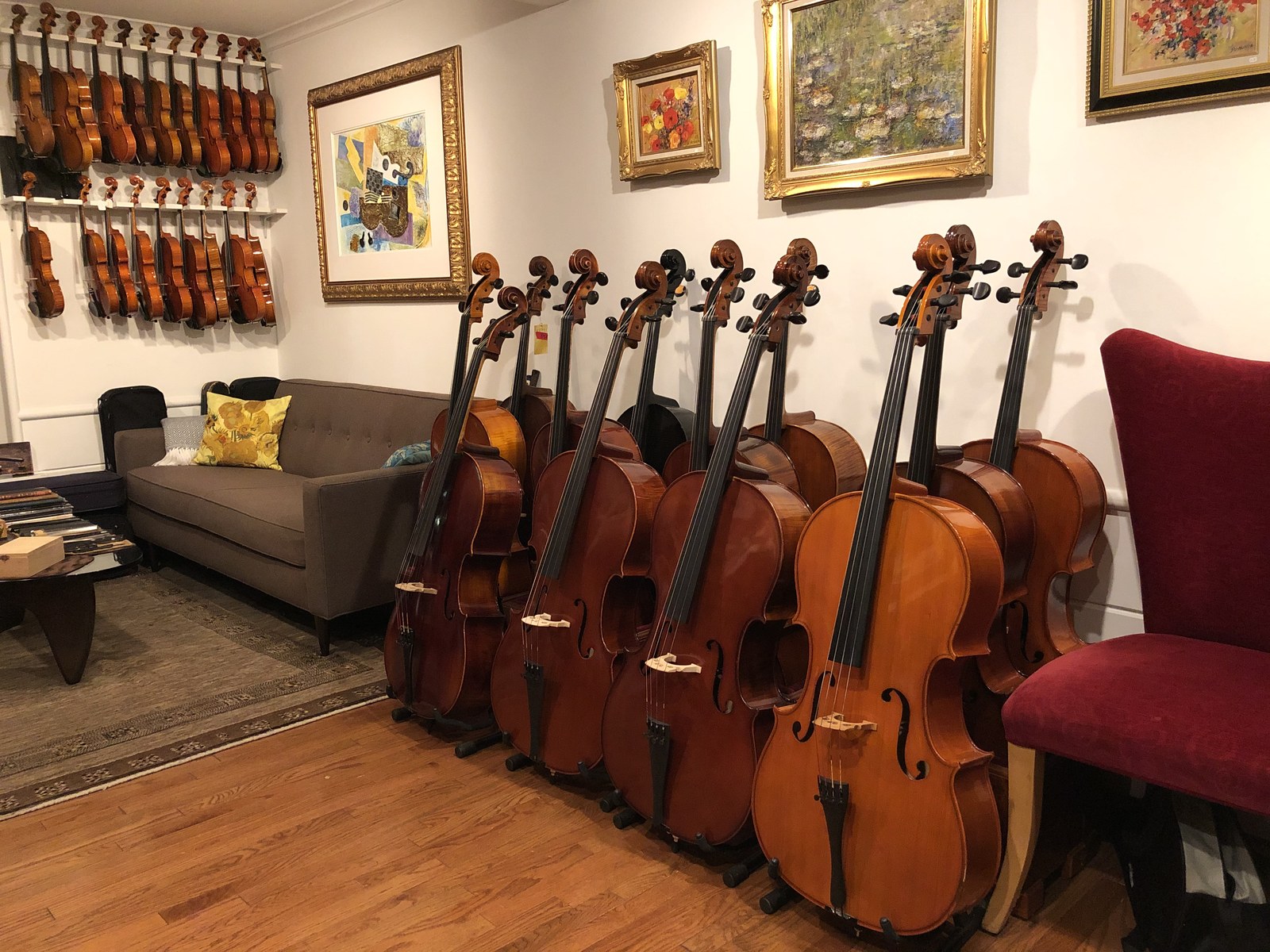 The Norwalk showroom, with cellos on stands and violins on the wall