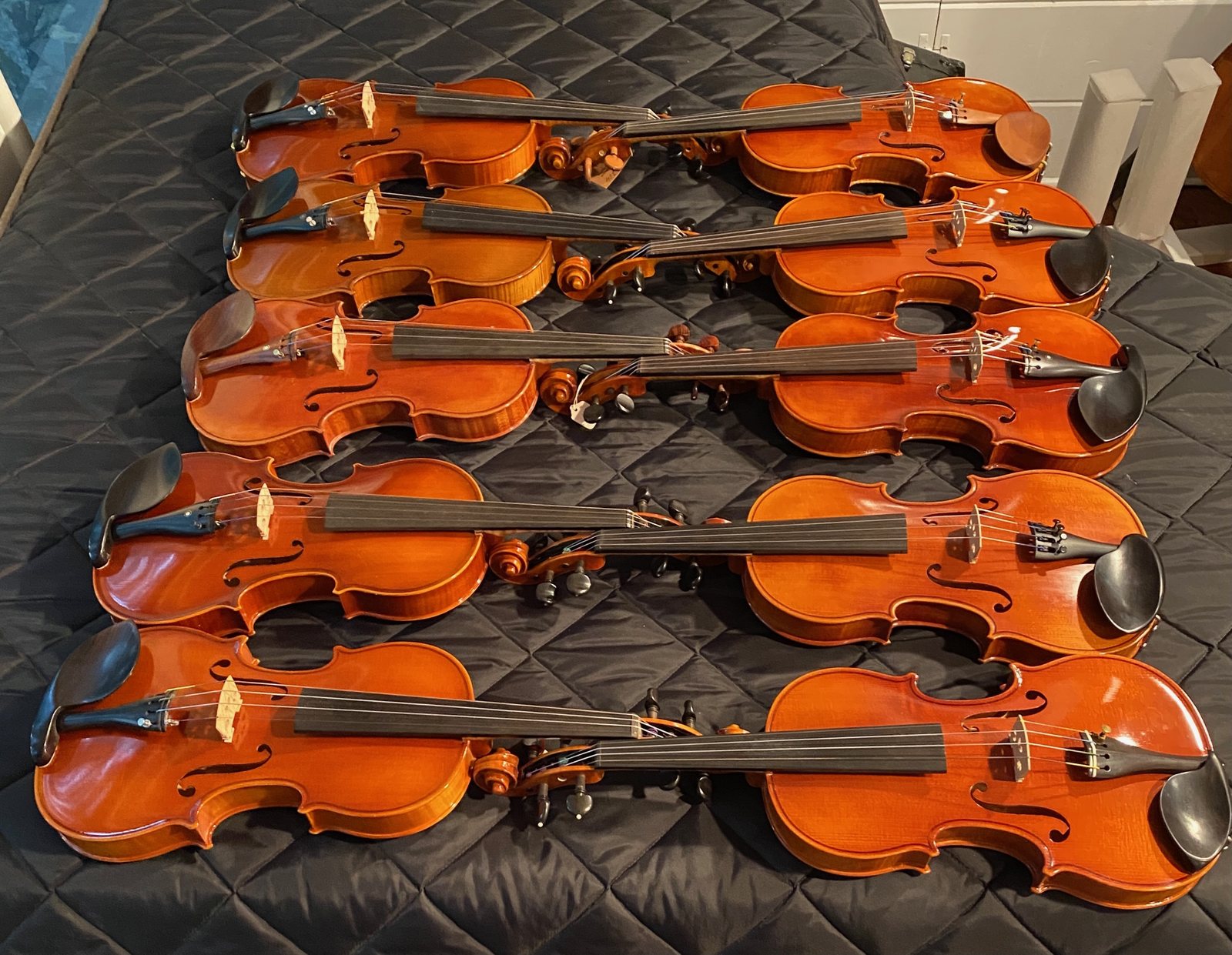Violins tagged and laid out for a school order
